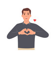 young man making or gesturing heart symbol vector image