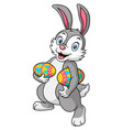 cute rabbit carrying an easter eggs vector image