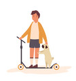 boy riding his kick scooter with a pug dog vector image