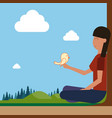 girl sitting on groud outdoors hold bird on hand vector image