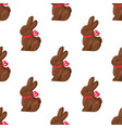 seamless pattern chocolate bunny with pink ribbon vector image