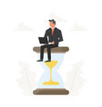 businessman with laptop sits on a big hourglass vector image