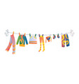 various items baby clothes on rope isolated vector image vector image