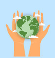 human hands holding earth globe with clouds vector image vector image