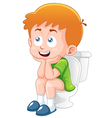 little boy is sitting on the toilet vector image