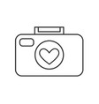 photo camera icon with a heart in lens vector image