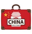 suitcase in colors of chinese flag vector image vector image